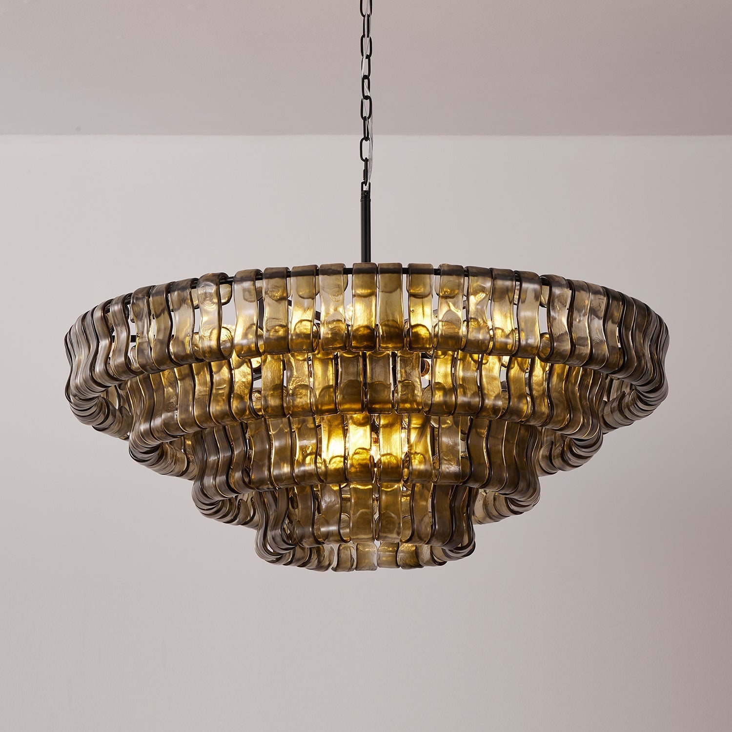 The dramatic effect of the Ghiaccio Chandelier in a luxurious hotel lobby.