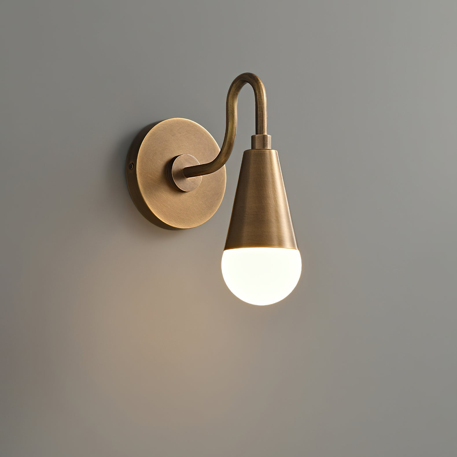 Detailed view of the wall mounting plate of the Harlan Sconce.