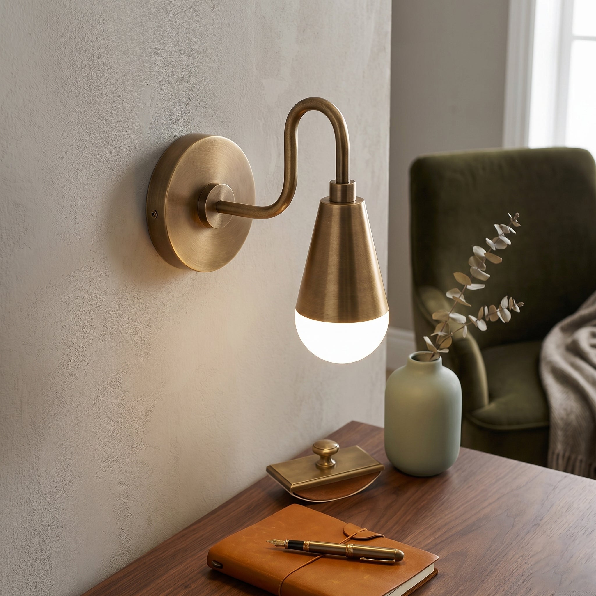 Close-up shot of the antique brass finish and gooseneck arm.