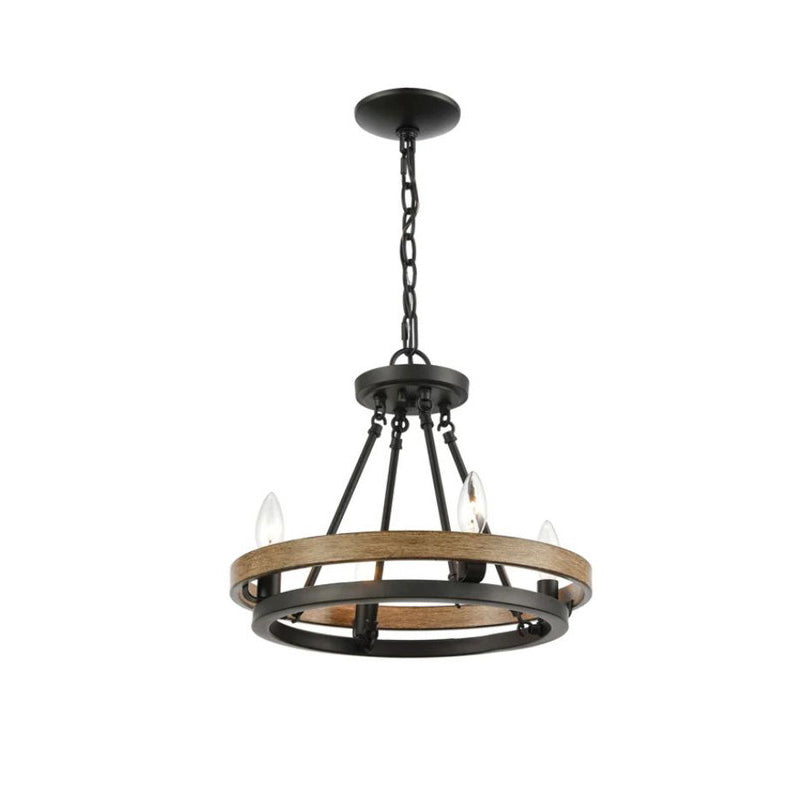 The wagon wheel chandelier hanging over a wooden dining table.