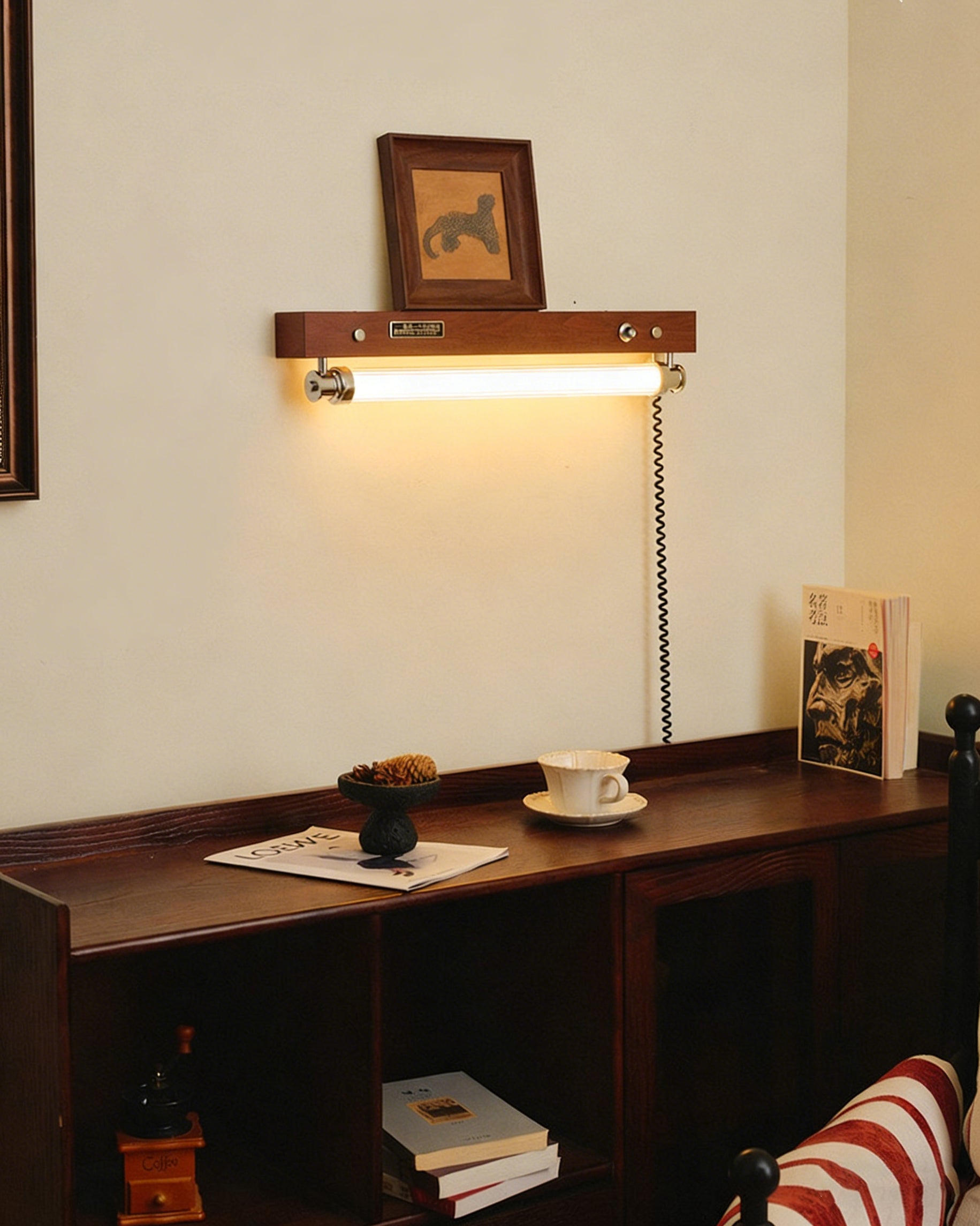 Side profile of the Hopper Wall Sconce showing its slim dimensions.