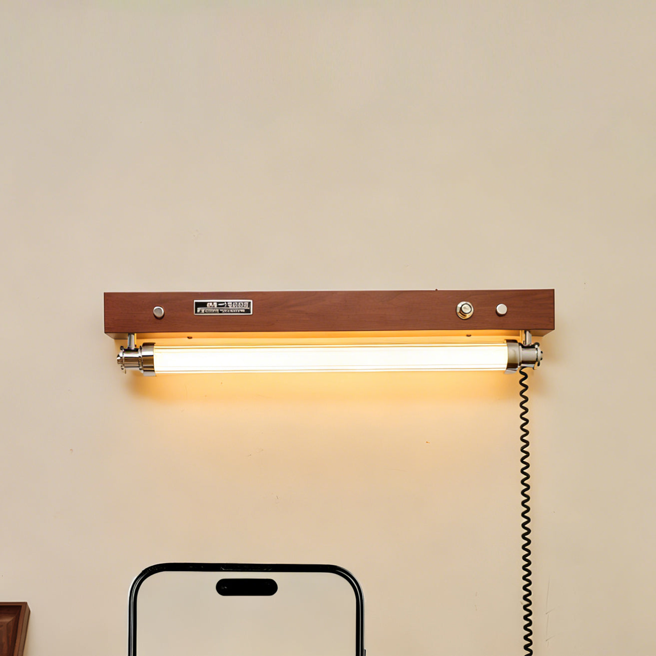 The small Hopper Wall Sconce, ideal for narrow walls or beside a bed.