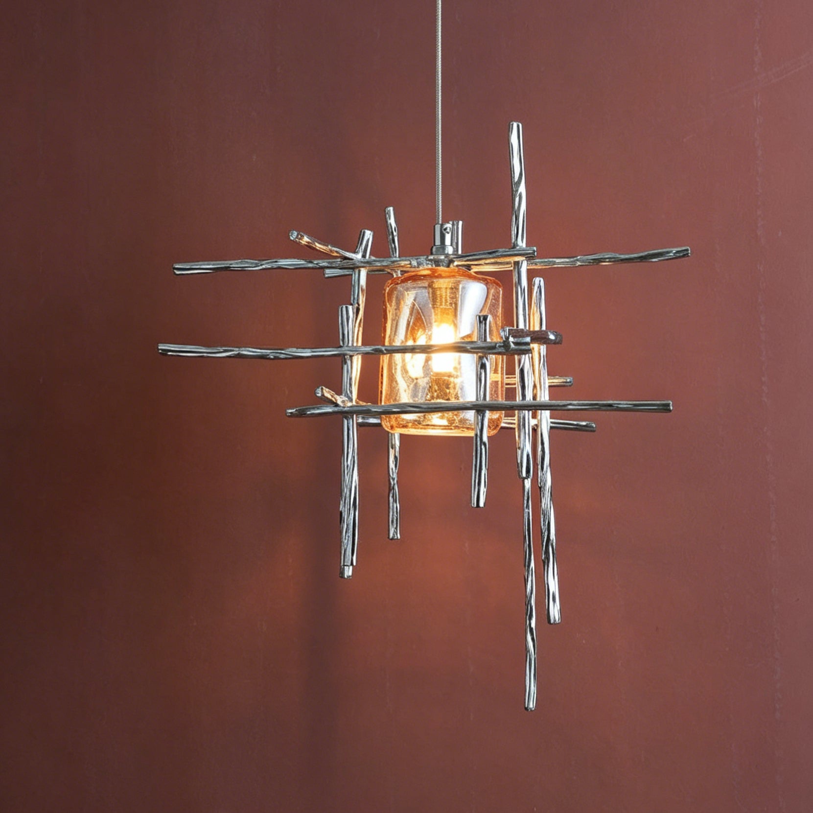 The industrial design of the Kova Pendant Light in a gallery-style entryway.
