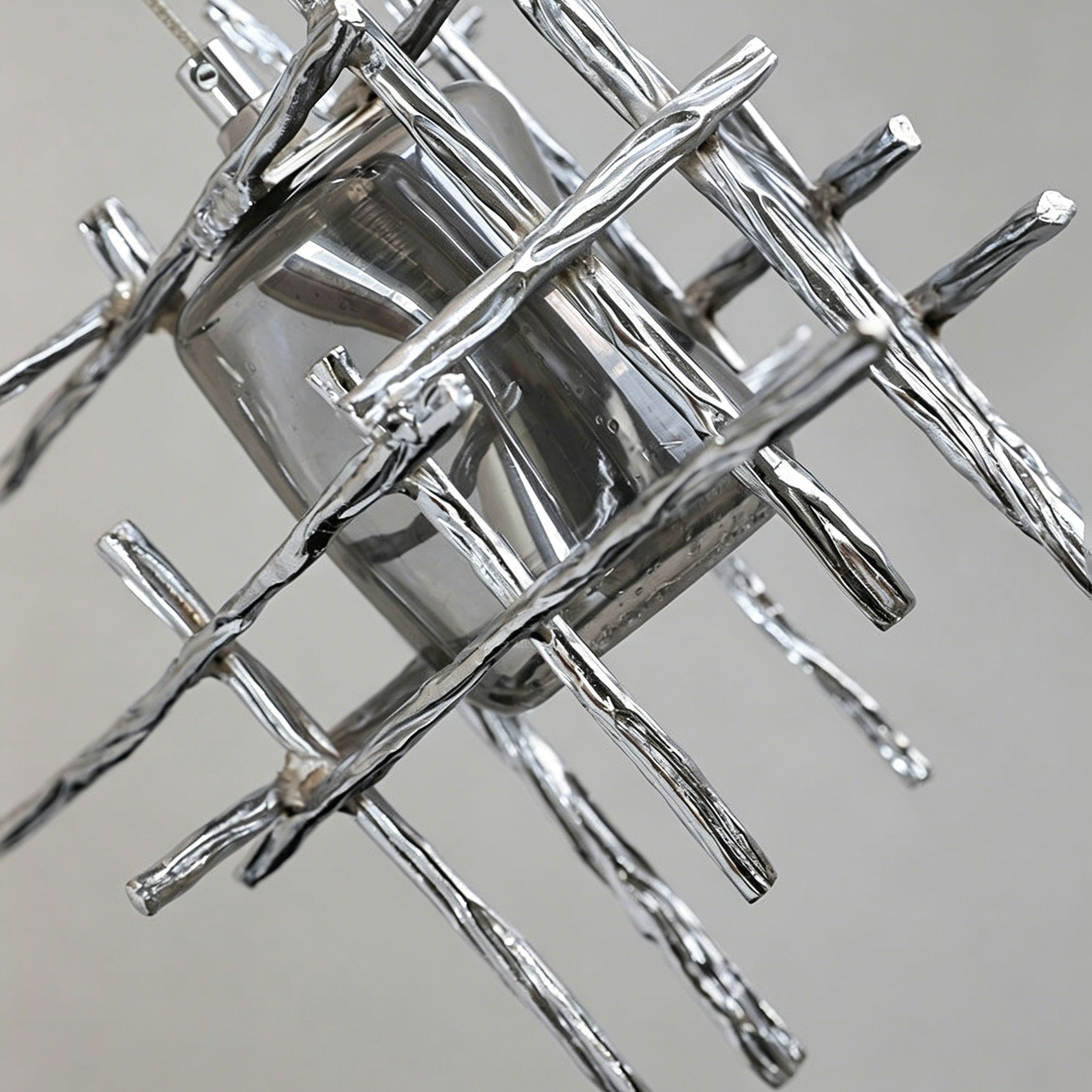 Side profile of the Kova Glass Pendant Light showcasing its cage structure.