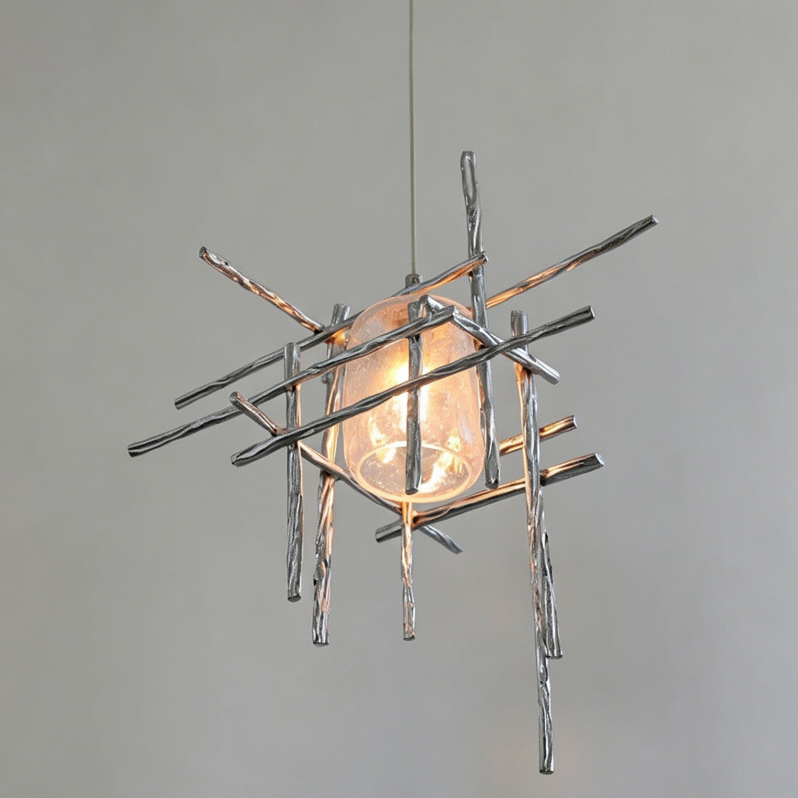 The Kova Pendant Light in smoky gray, unlit, against a white background.