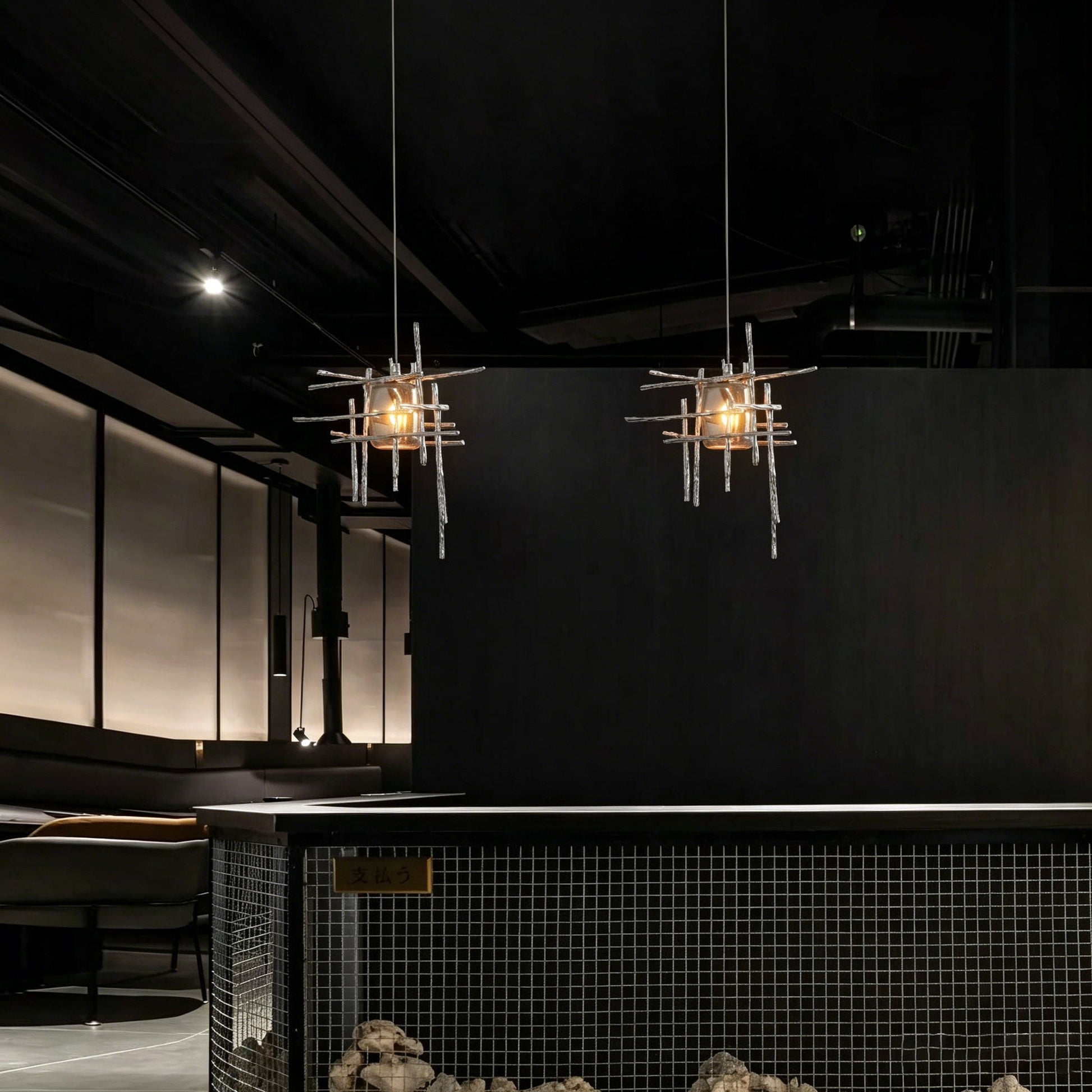 The Kova Pendant Light in amber glass, highlighting its warm tone.