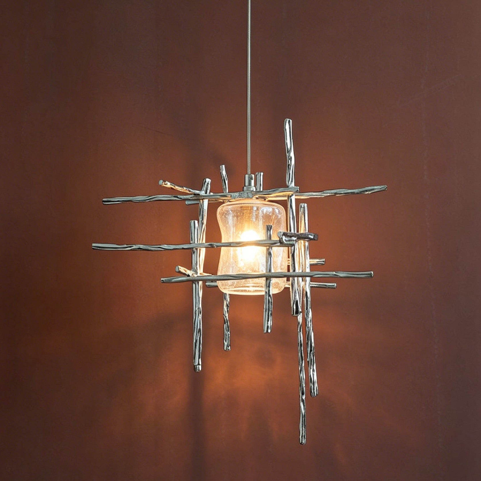 Close-up of the Kova Pendant Light's textured cast metal rods.