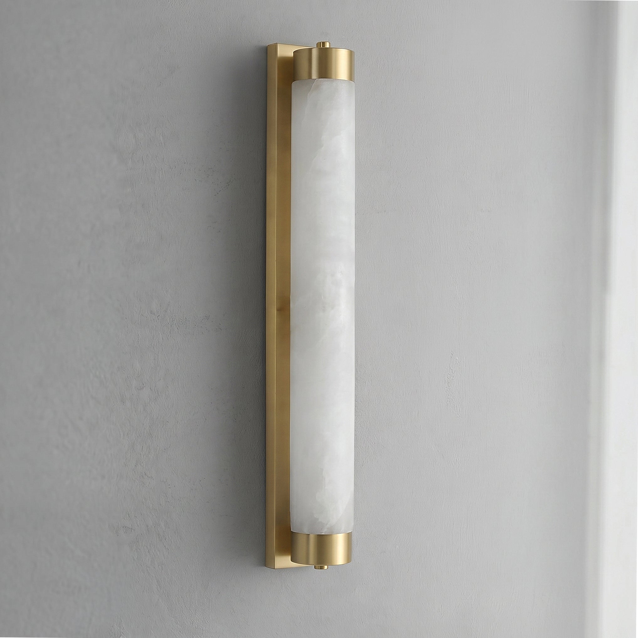 The sconce from a low angle, looking up its linear form.