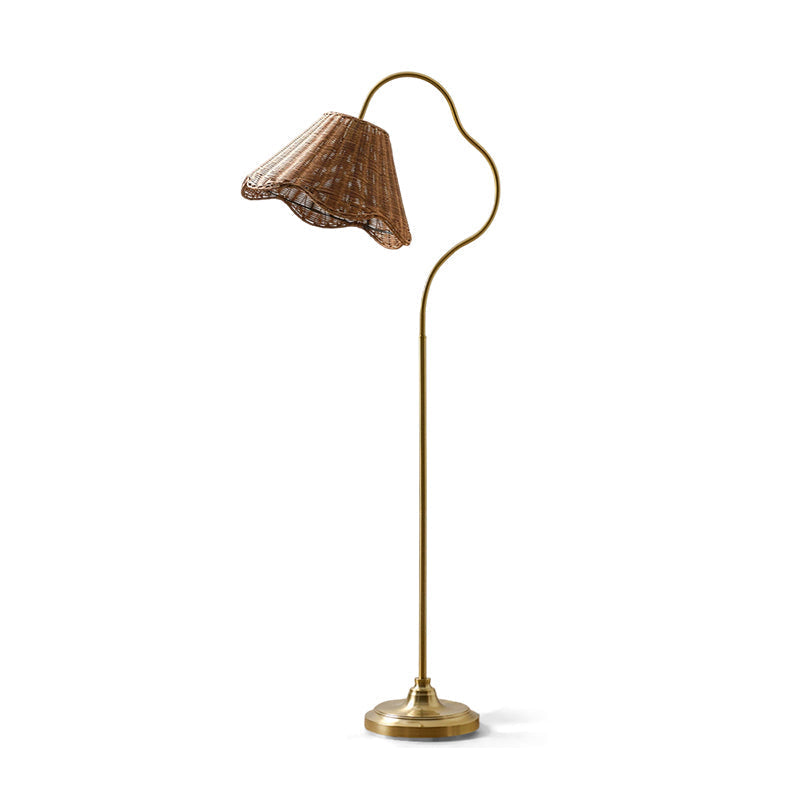 Detail shot of the lamp's metal base and foot switch on a wooden floor.