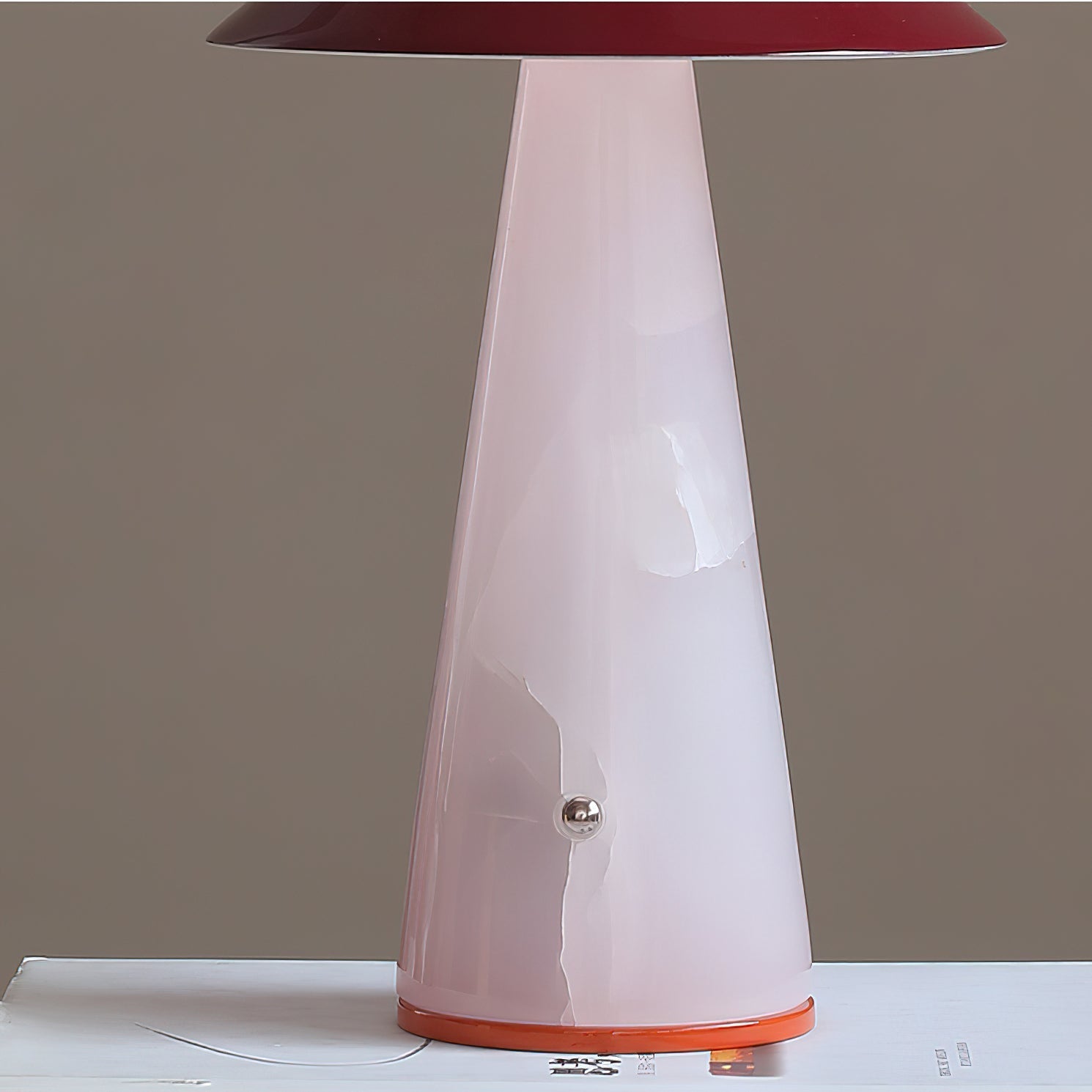The blue Maisie lamp shown in a contemporary living room setting.