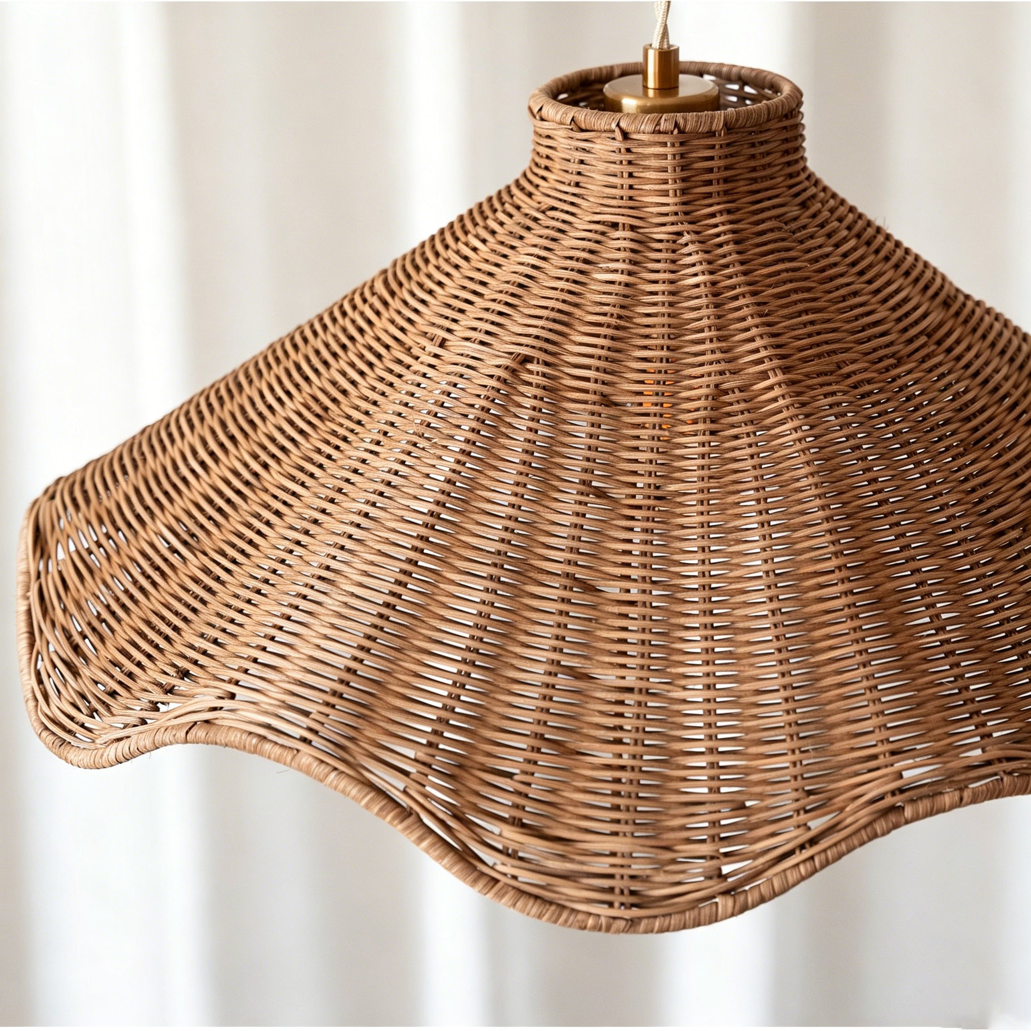 Maren pendant light illuminating a cozy living room corner.