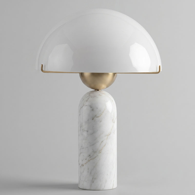 The lamp used as accent lighting in a minimalist office space.