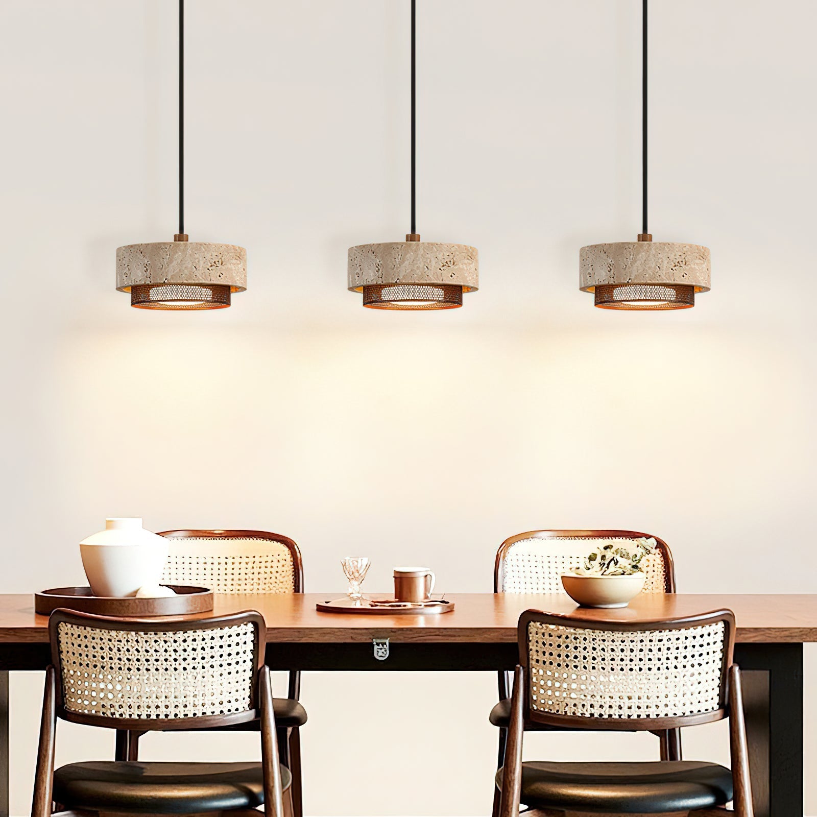 The single Nolan Pendant Light illuminated in a dark room.