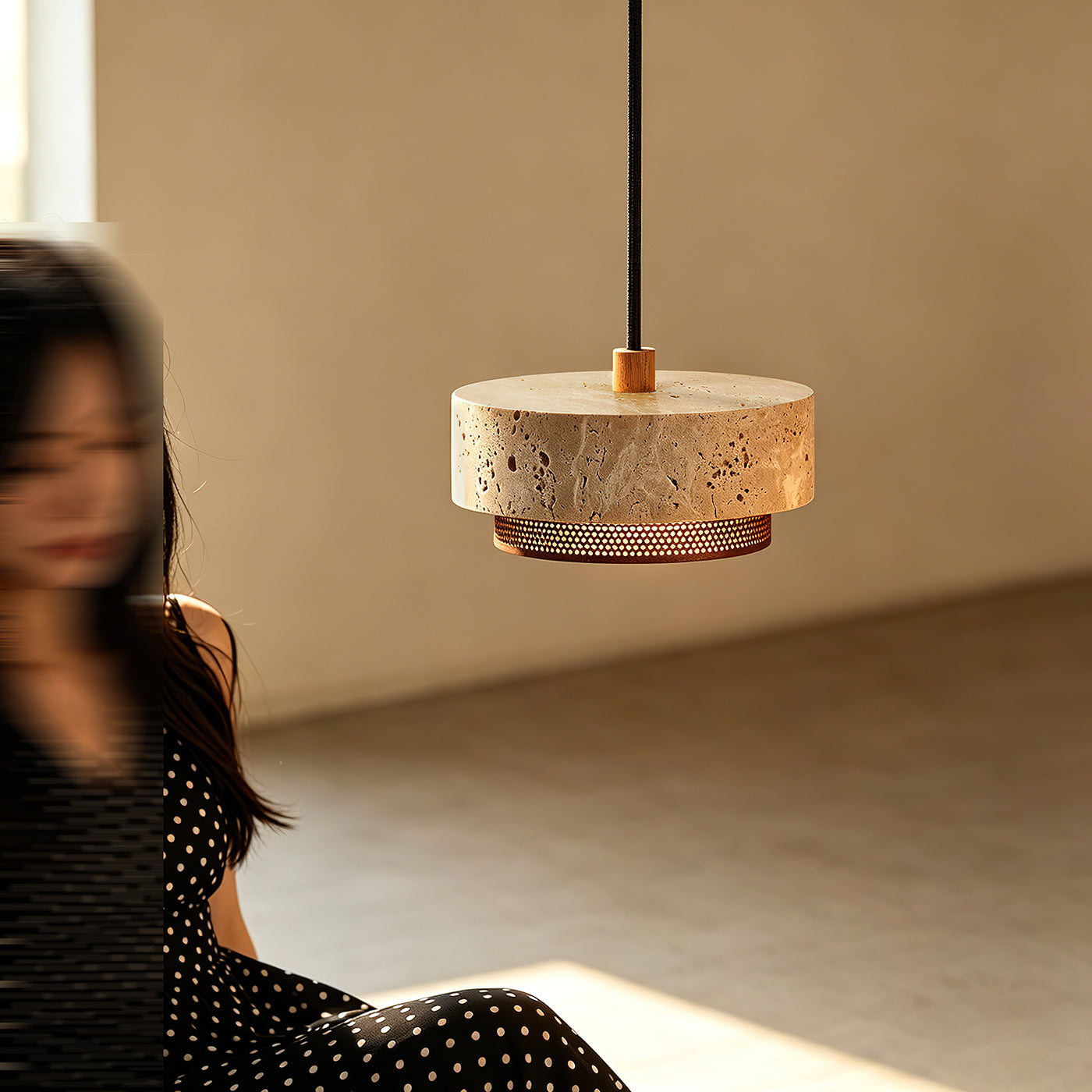 The 3-light Nolan Pendant Light version with walnut accents over a dining table.