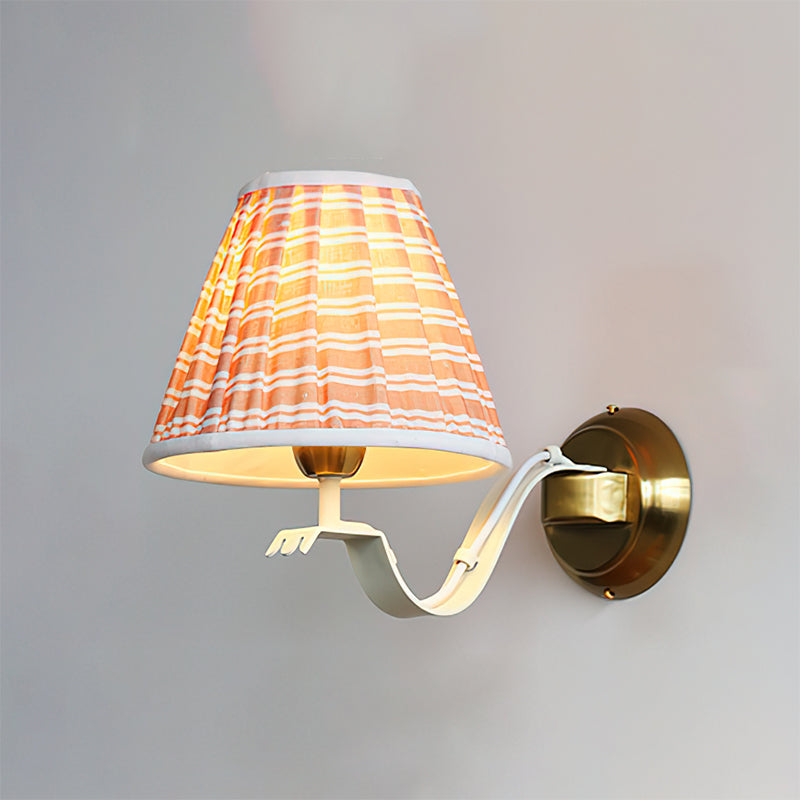 The sconce shown with a vintage-style Edison bulb.