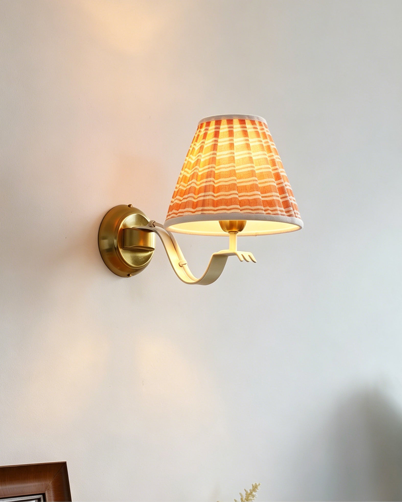 Penelope Wall Sconce shown in a cottage-style bedroom.