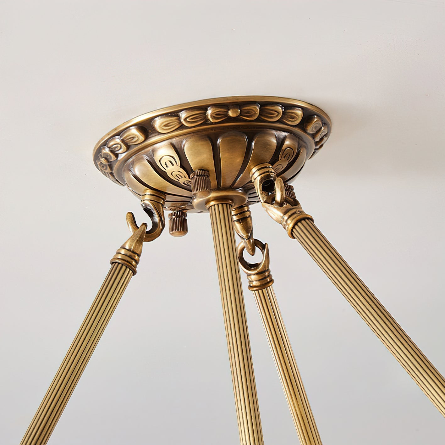Detail of the ceiling mounting canopy in a brass finish.
