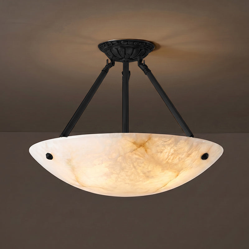 The black finish pendant lamp against a light-colored ceiling.