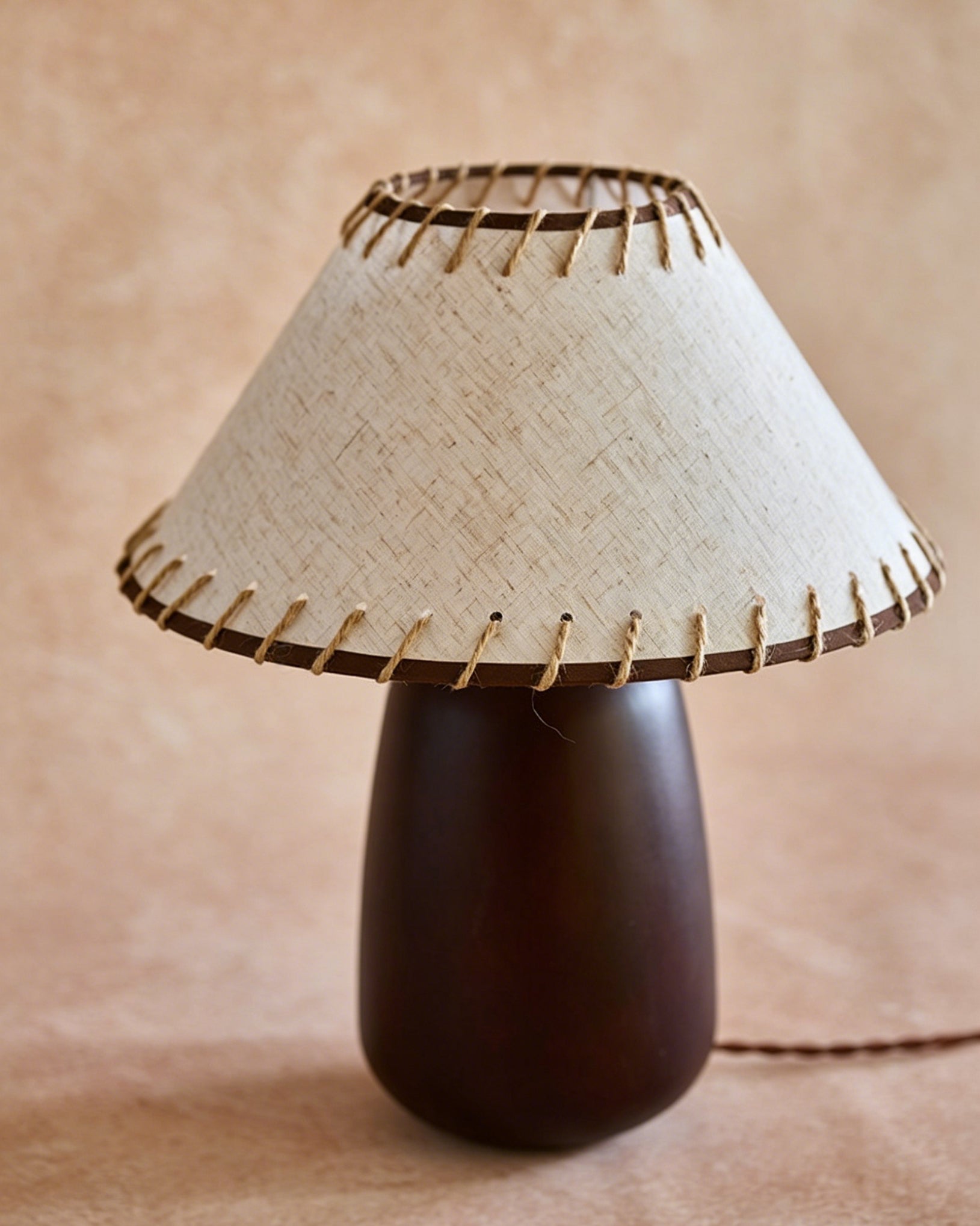 Douglas Walnut Table Lamp placed in a modern living room.