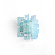 Stagger Cast Glass Sconce in a modern hallway setting.