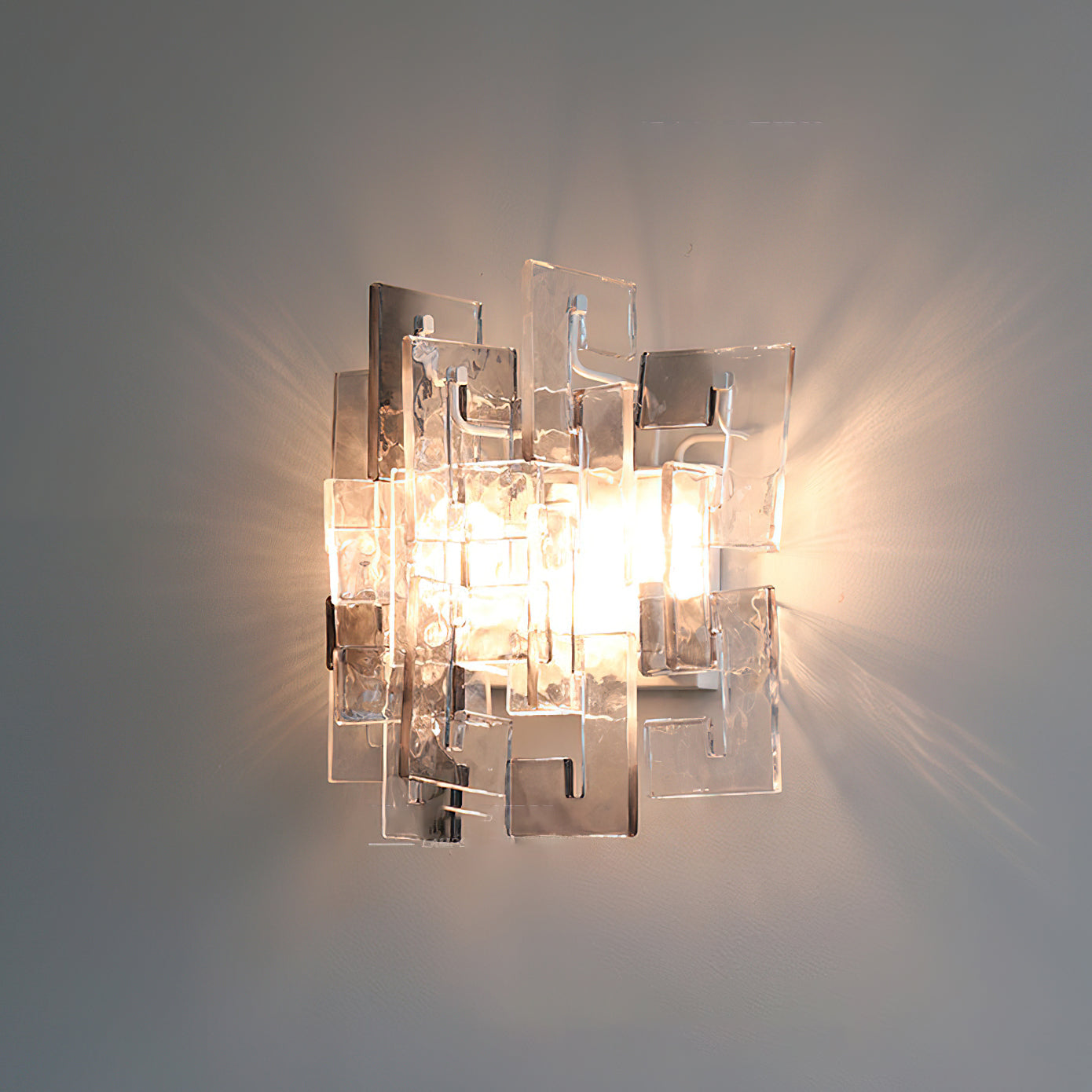 Front view of the Stagger Cast Glass Sconce in Smoky Gray finish.