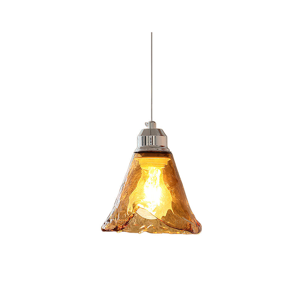 Tiro Glass Pendant Light with a single amber shade against a neutral background.