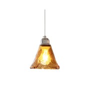 Tiro Glass Pendant Light with a single amber shade against a neutral background.