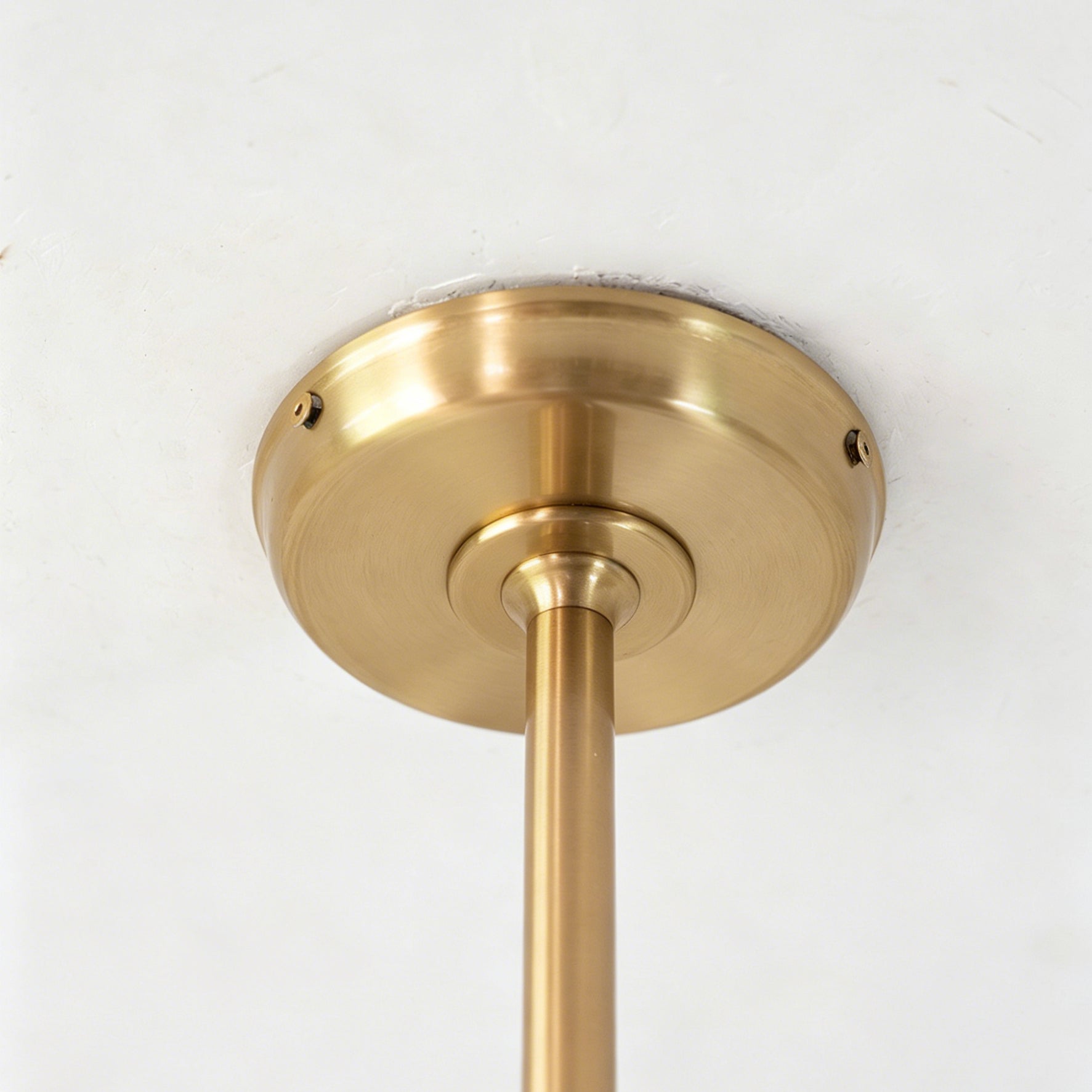 Another angled view of the Zane pendant light, emphasizing its fluid, kinetic design.