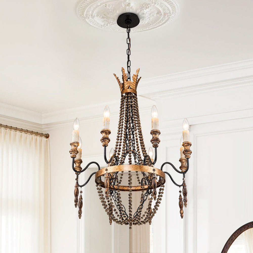 Close-up of the antique gold finish on the chandelier's iron body.