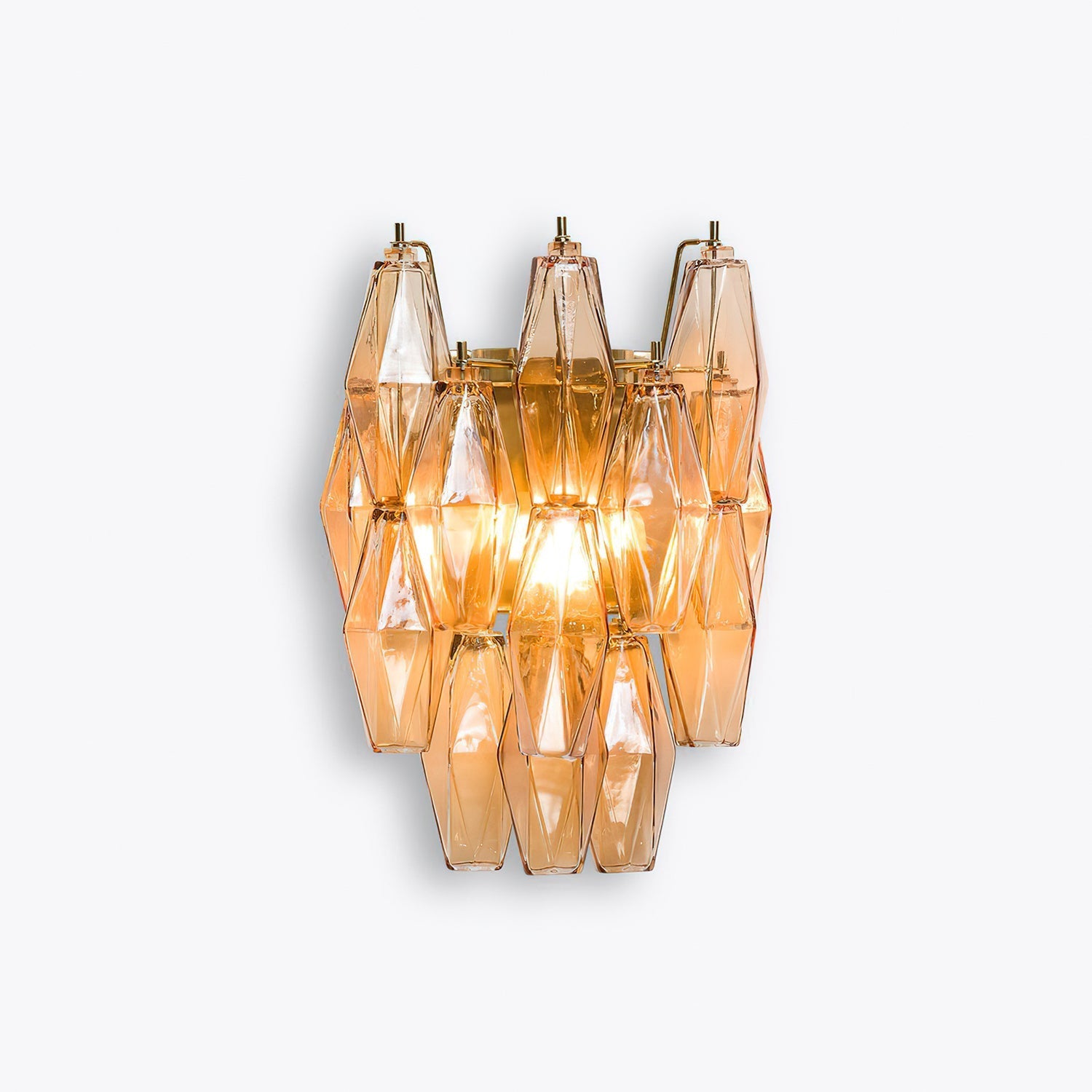 Delano sconce illuminated in a dimly lit room.