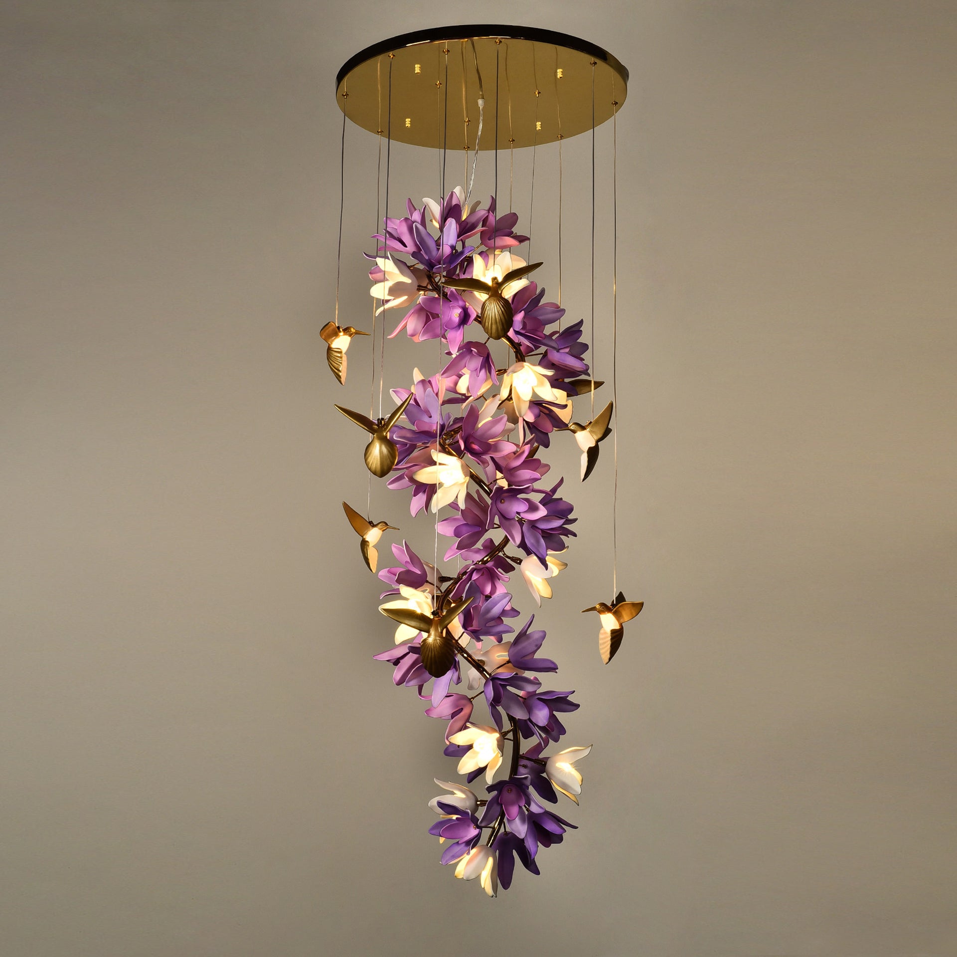 Full view of the chandelier with its long suspension wire.