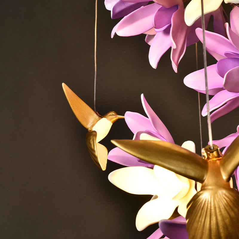 A shot showing the scale of the chandelier in a large room.