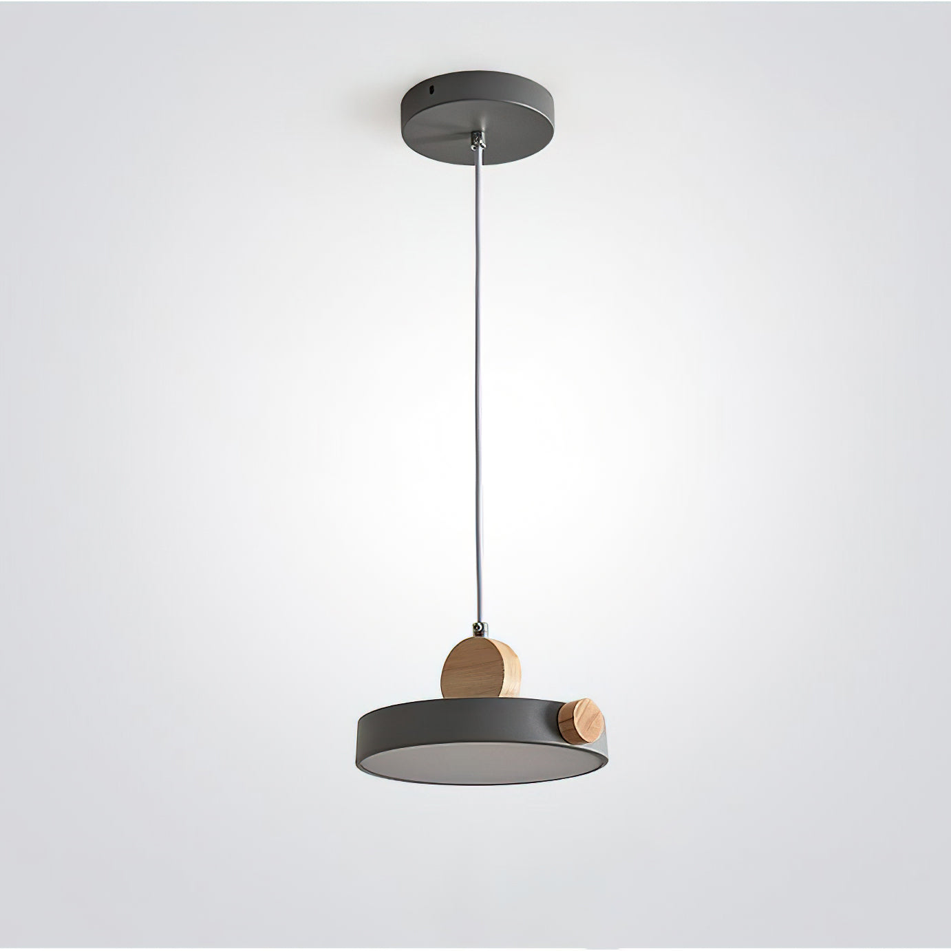 Lifestyle image of the Detroit Pendant Light over a dining table.
