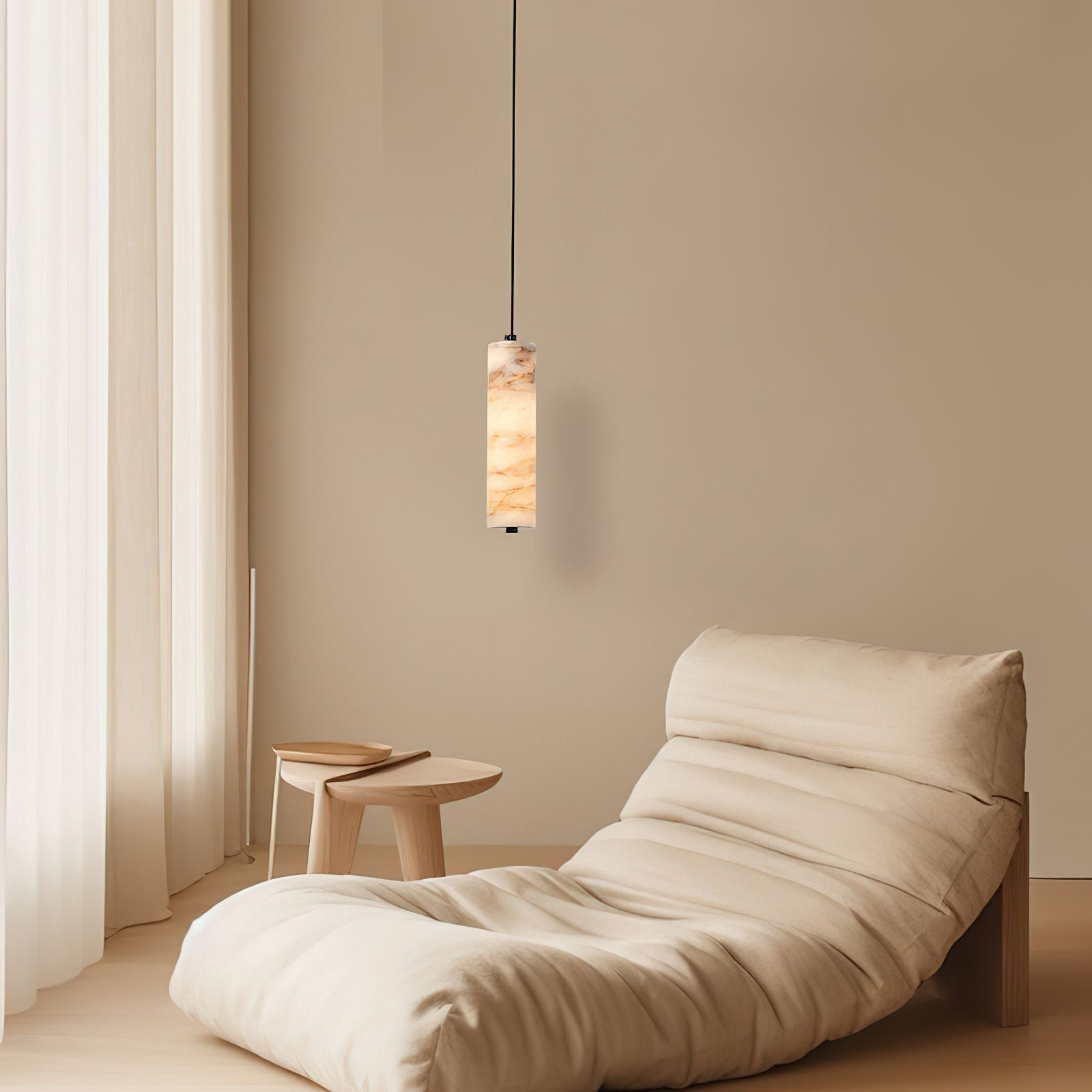 A series of Devane Alabaster Pendant Lights hanging over a modern kitchen island.