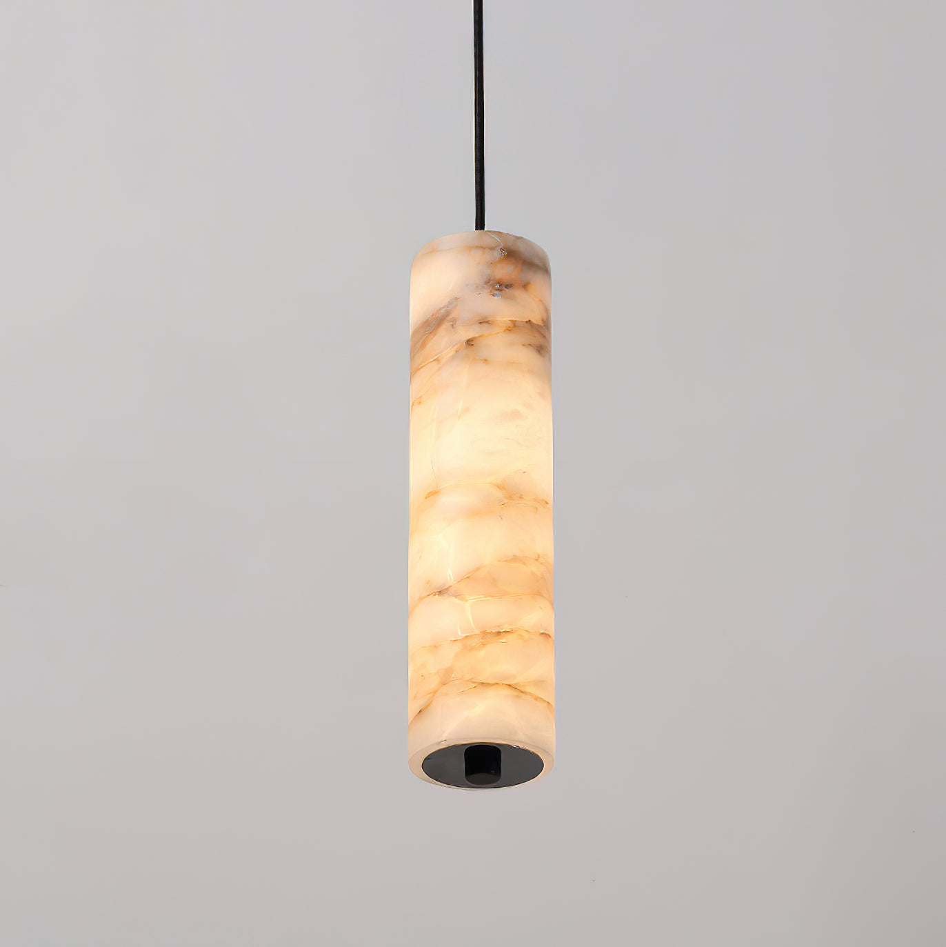 The 3-light linear configuration of the Devane Alabaster Pendant Light.