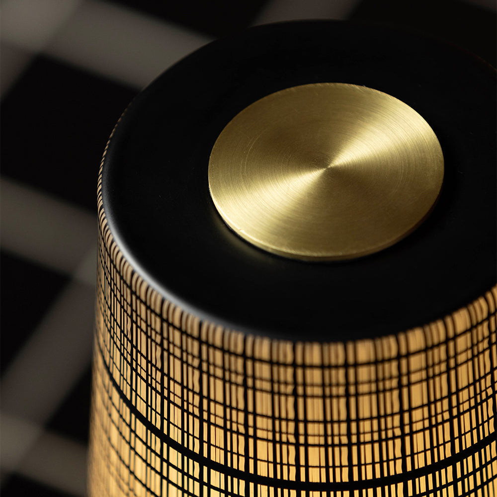 The lamp on a desk, providing task lighting.