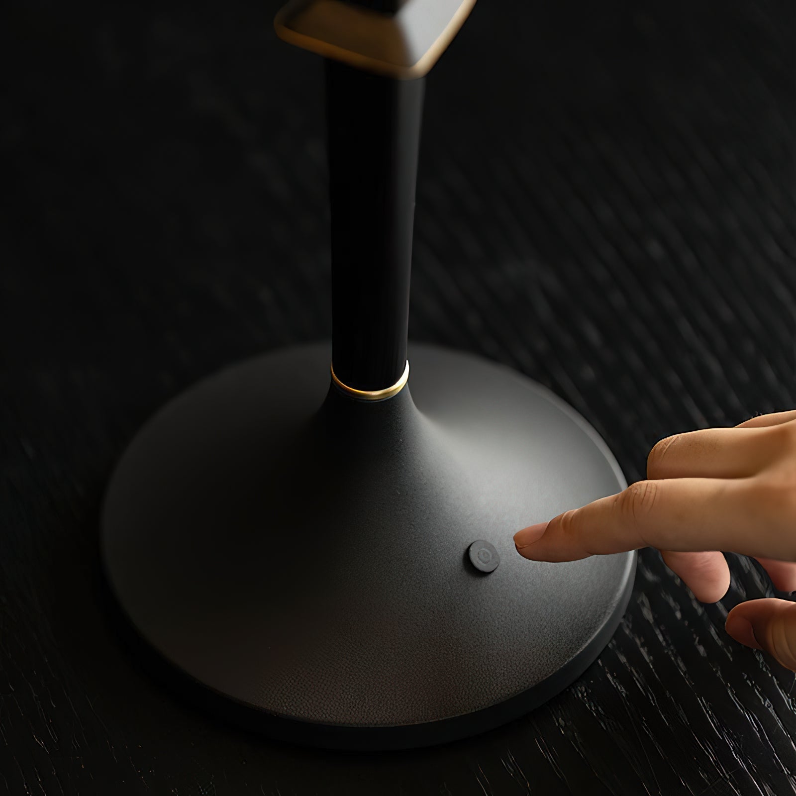 The complete Devon Black Table Lamp with its charging cable.