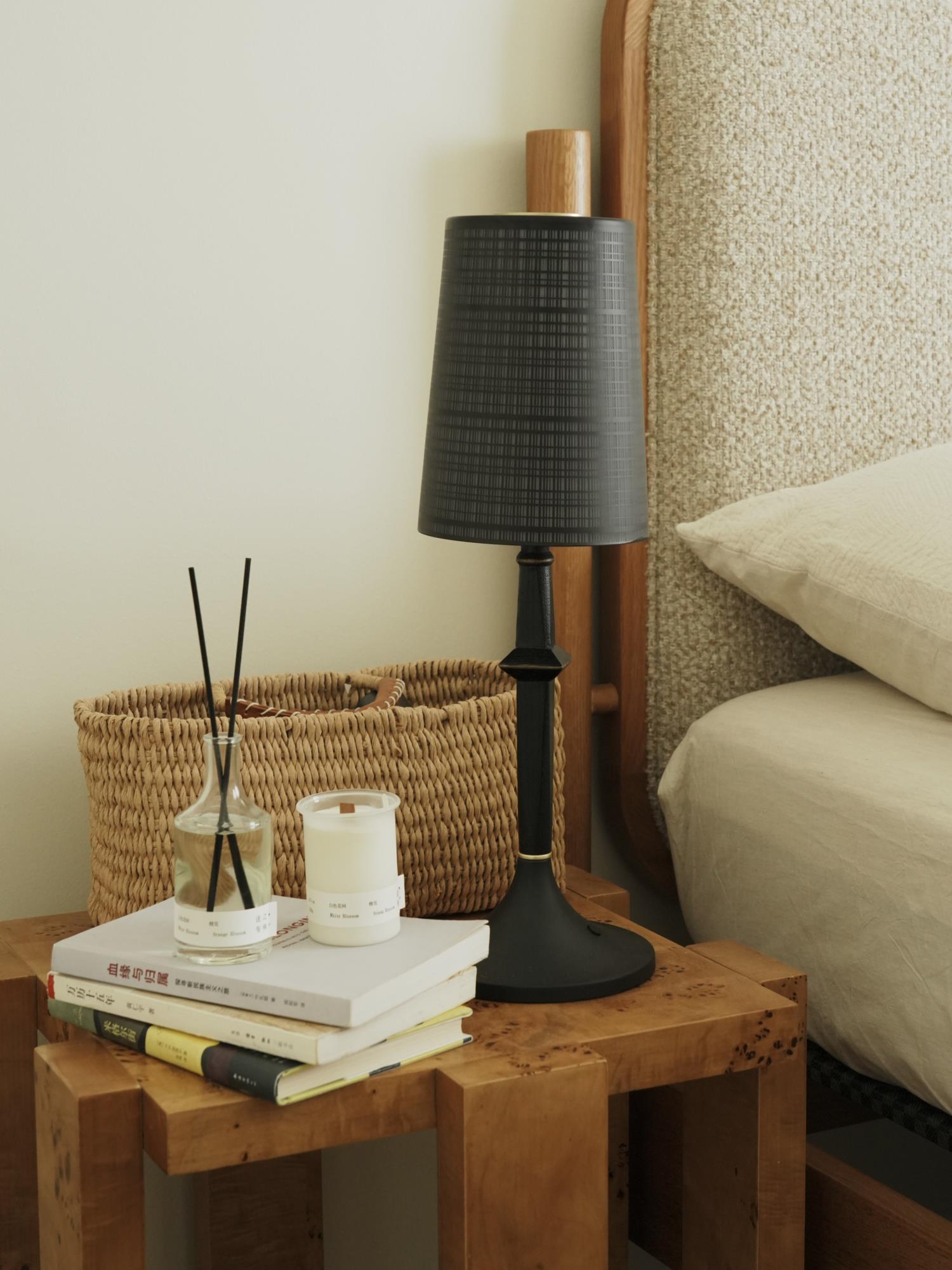 The Devon Black Table Lamp shown in a modern living room setting.