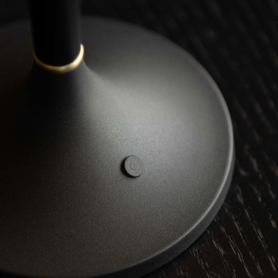 The lamp shown in a minimalist interior.