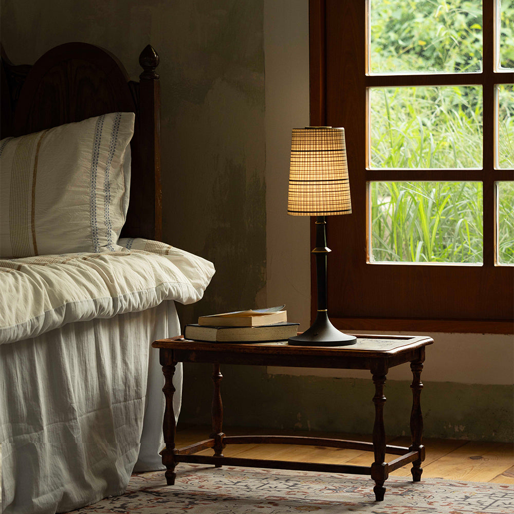 Angled view of the Devon Black Table Lamp, highlighting its sleek profile.