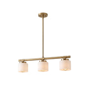 Devon Linear Pendant Lamp in brass finish over a modern kitchen island.