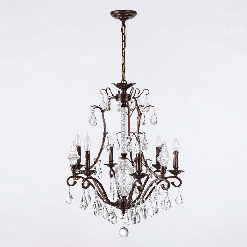 The chandelier unlit, showcasing its intricate metal and crystal design.