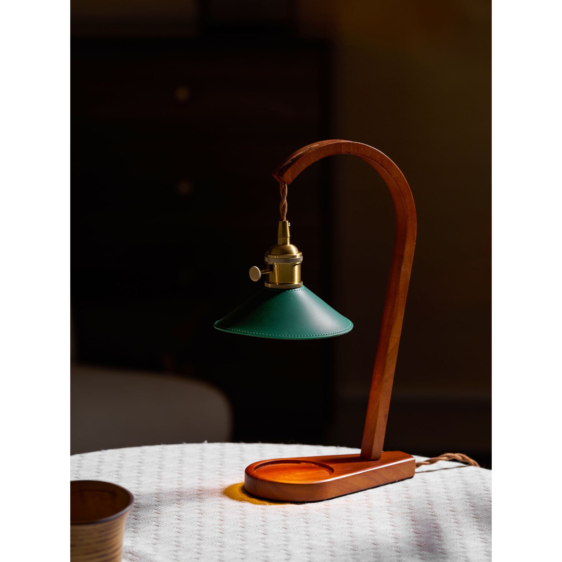 Three-quarter angle view of the sculptural candle warmer lamp.