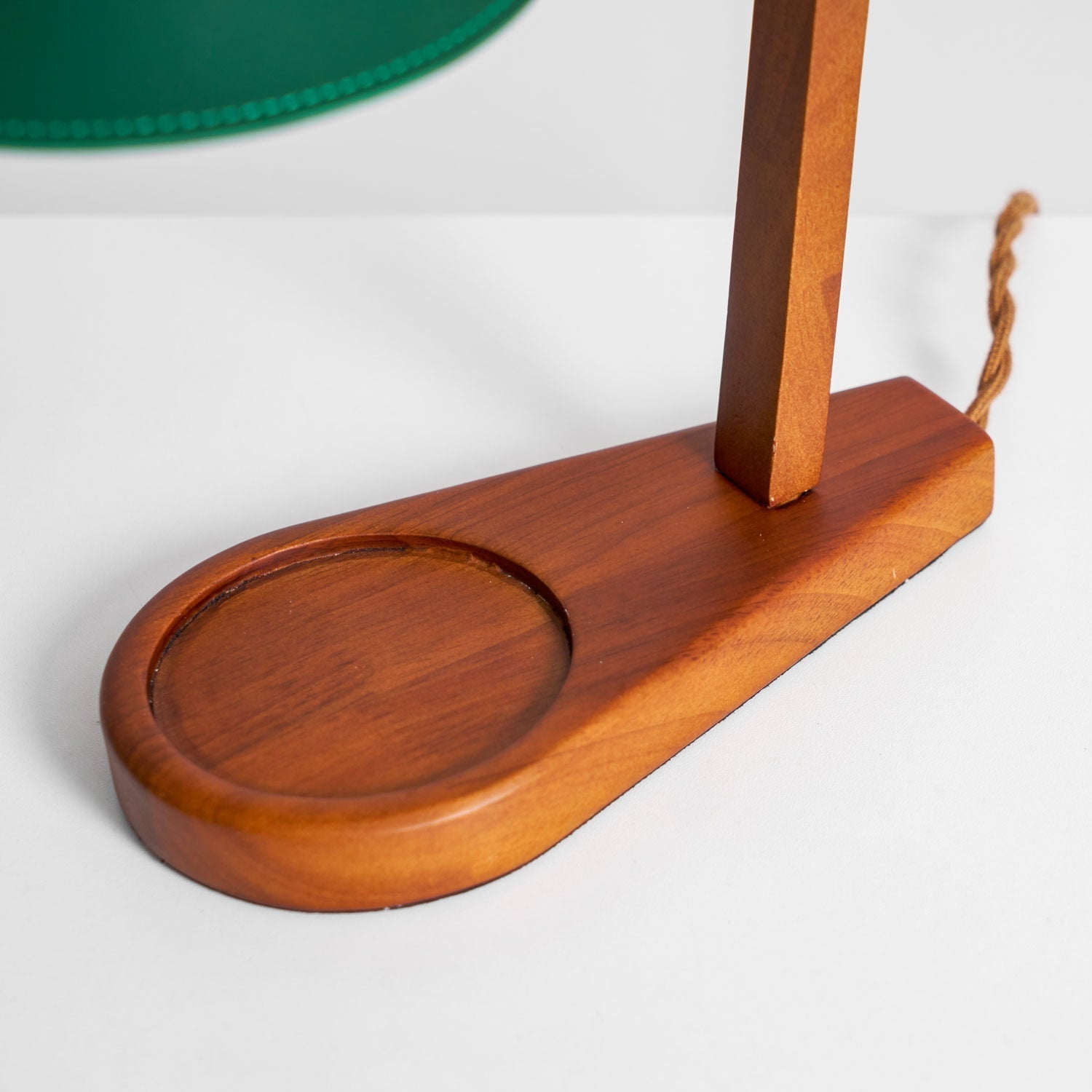 The lamp placed on a bookshelf, adding a touch of elegance.