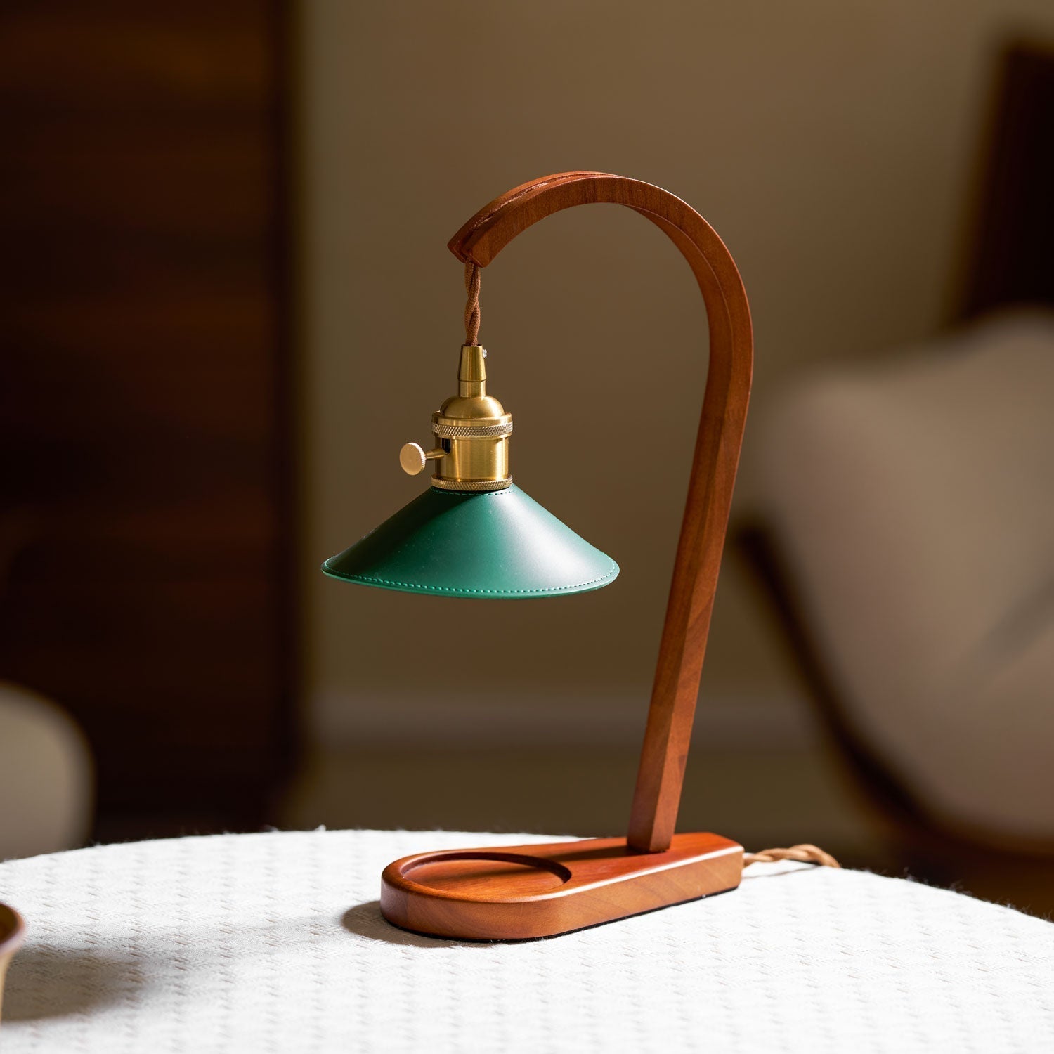 The candle warmer lamp illuminating a dark room with a soft, warm glow.