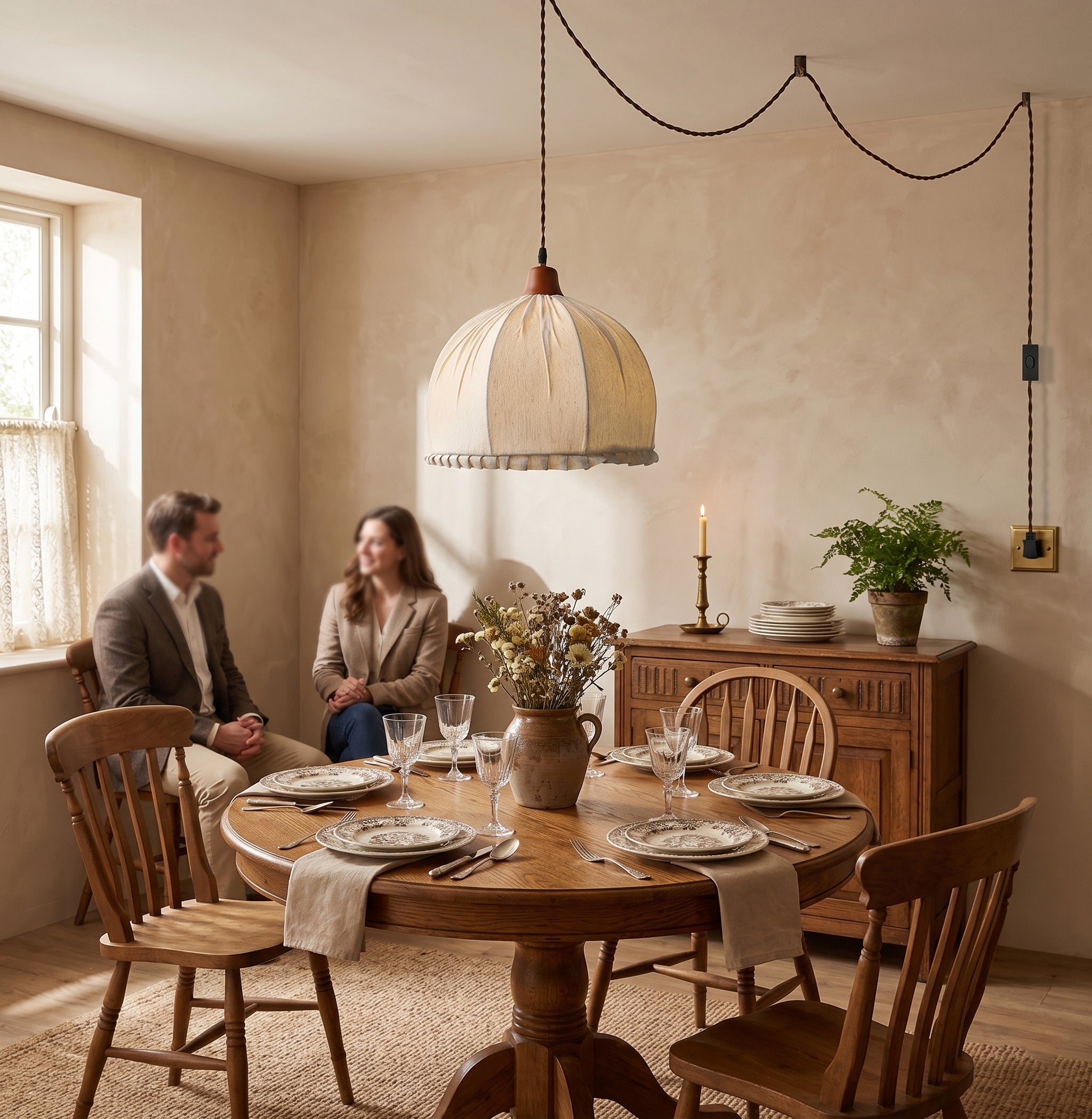 Lifestyle view of the Dippa Swag Pendant used as a bedside light.