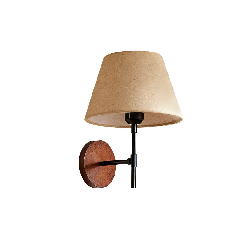 The Dodie Wall Light from a side profile view, showing its structure.