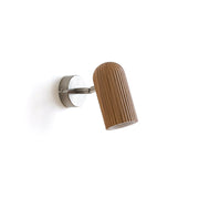 Donovan Wall Lamp in black finish against a neutral wall.