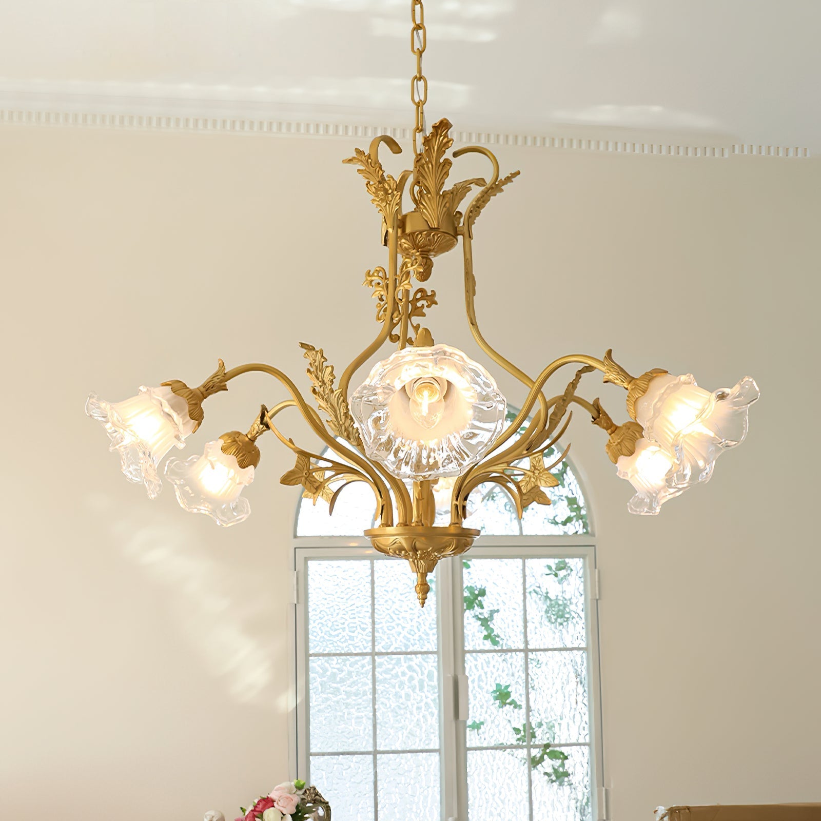 Dore Flower Chandelier hanging in a sophisticated dining room.