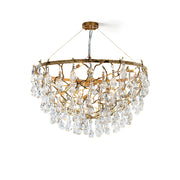 Doris Chandelier with antique brass finish and cascading crystal drops, shown lit.